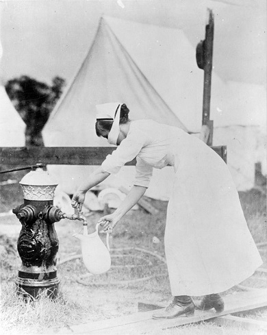 nurse wearing a mask while getting water national archives september 13 1918 65