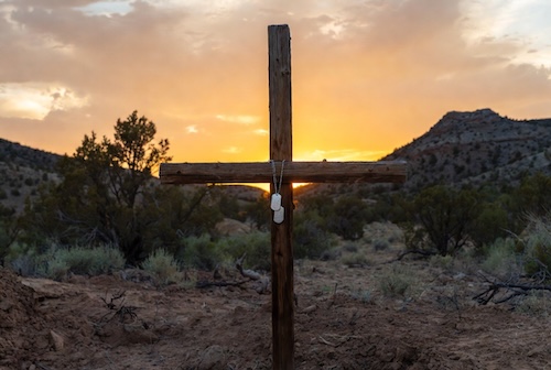 cross with dog tags